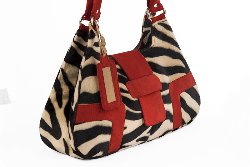 Handcrafted women's luxurious elegant handbag in animal print and cardinal red. Perfect for elevated everyday style.   
                Choose from our luxurious collections of leather and fabric to perfectly match your handbags to your outfits.